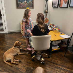 therapy dog in room during a therapy session